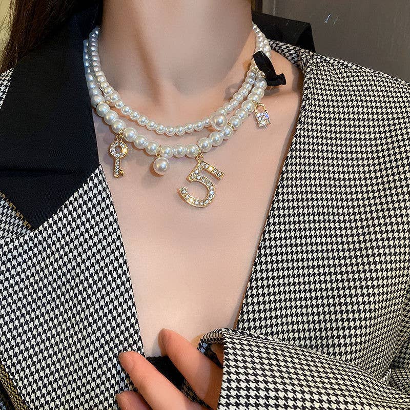 Pearlies Necklace with Symbolic Charms in Ivory