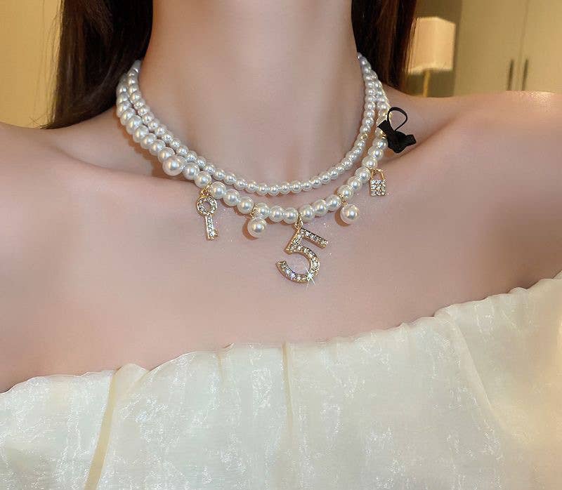 Pearlies Necklace with Symbolic Charms in Ivory