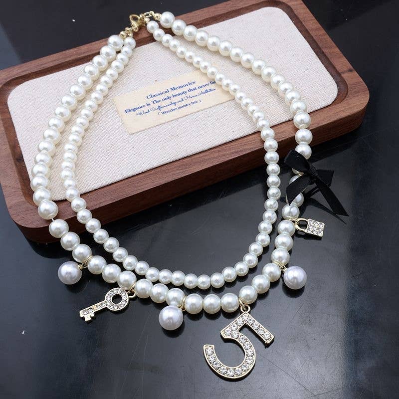 Pearlies Necklace with Symbolic Charms in Ivory