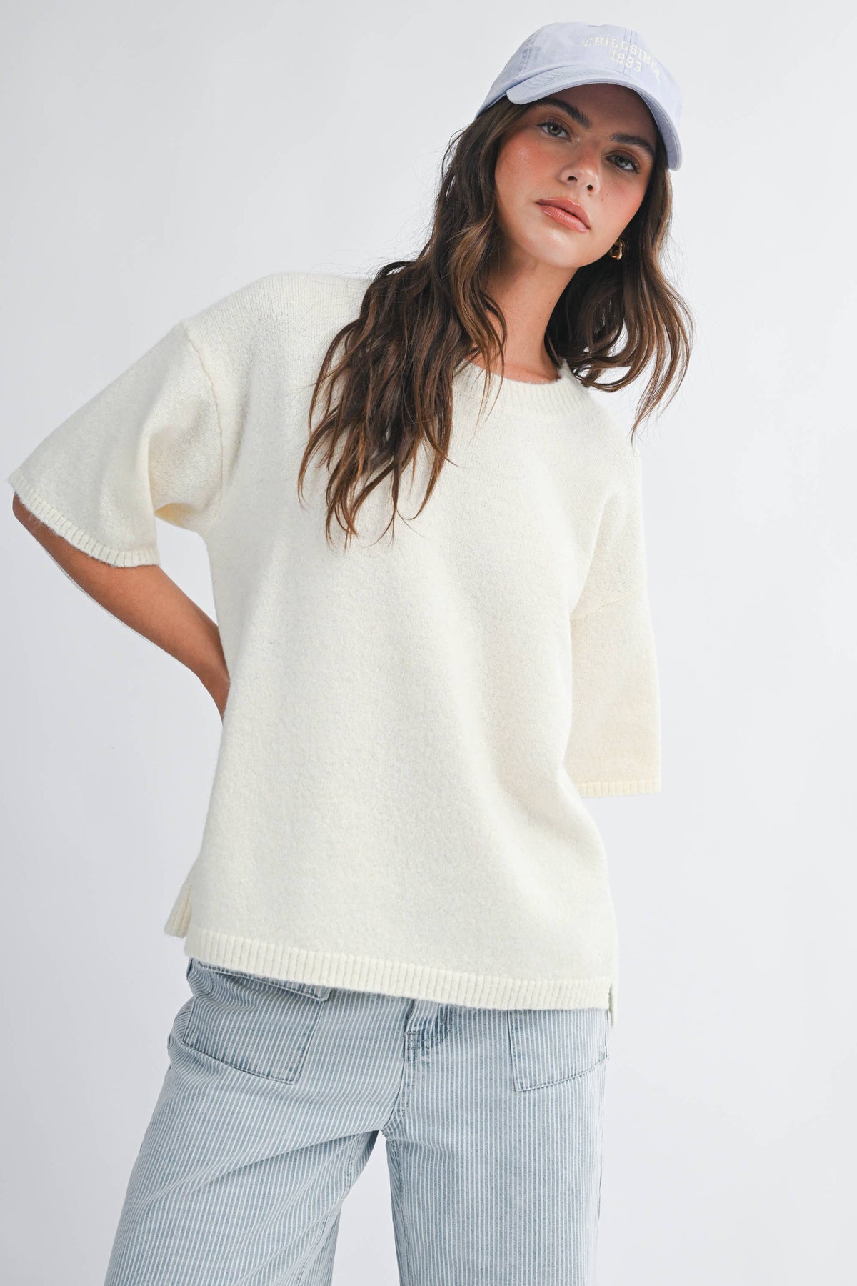 Soft knit top with ribbed details and relaxed fit.