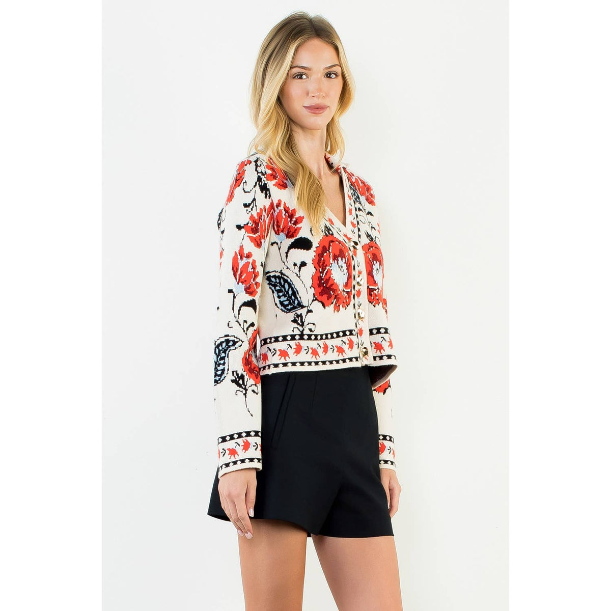 A stylish women's cropped jacket with knitted details and ribbed cuffs.