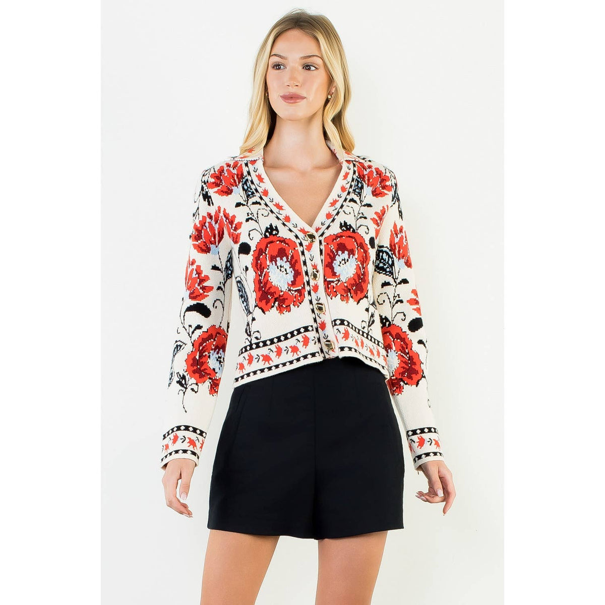 A stylish women's cropped jacket with knitted details and ribbed cuffs.