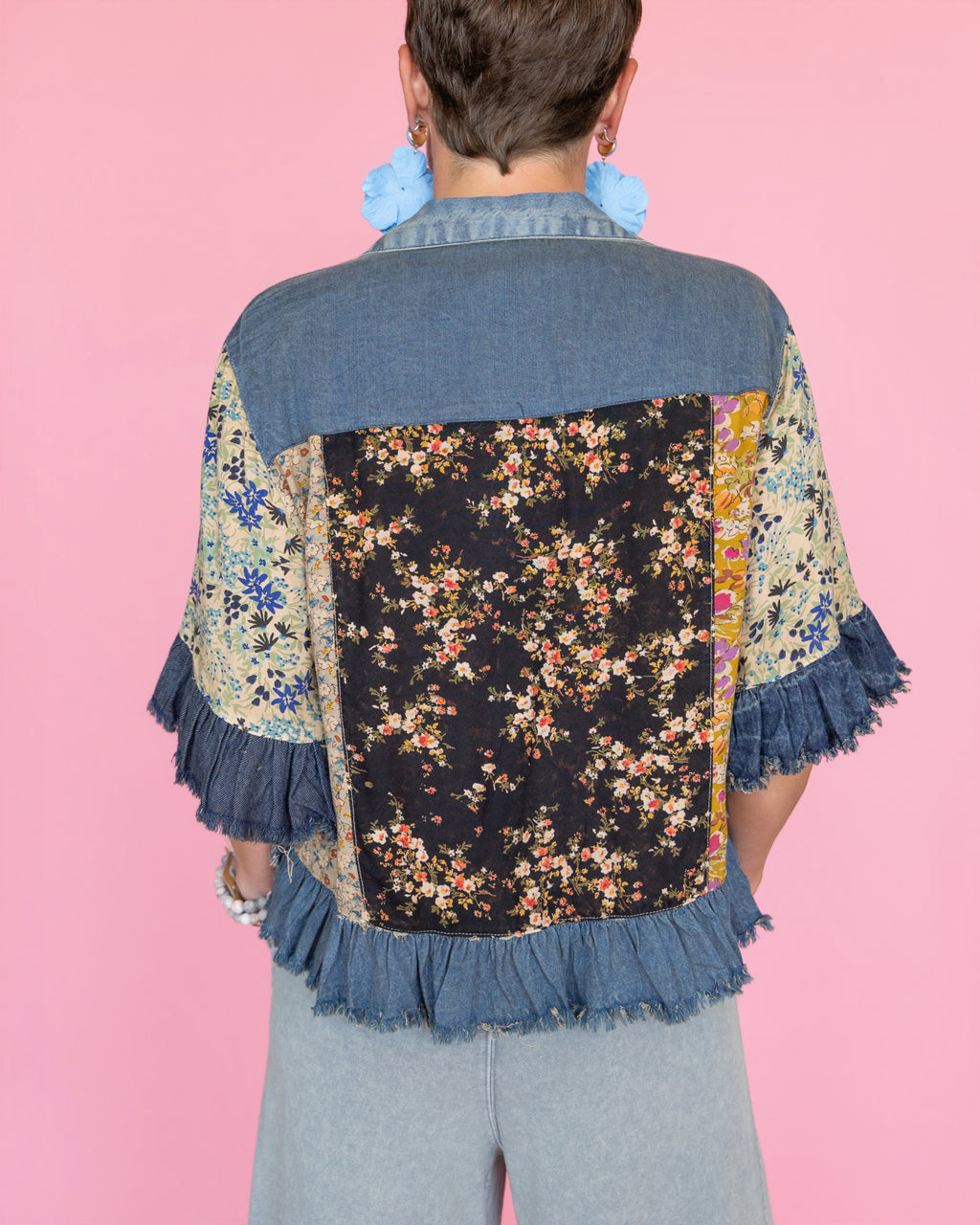 Distressed Denim Crop Jacket with Ruffled Hem