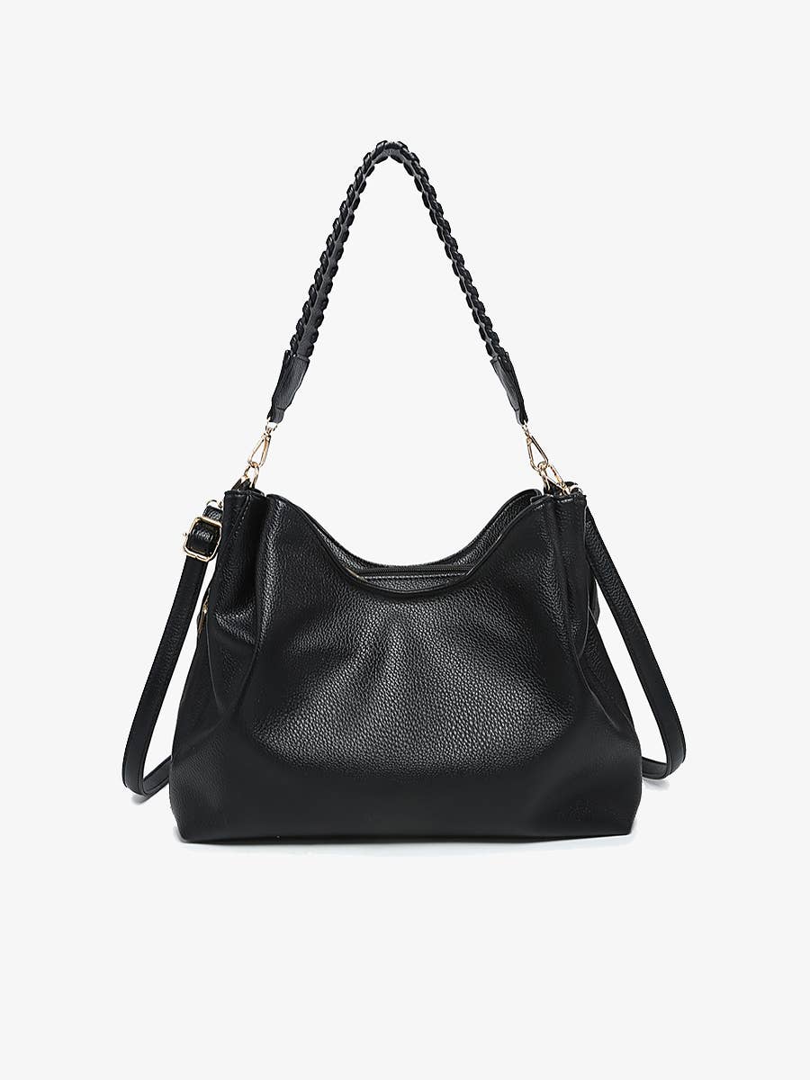 Multi-compartment leather tote with handcrafted details and top handle.