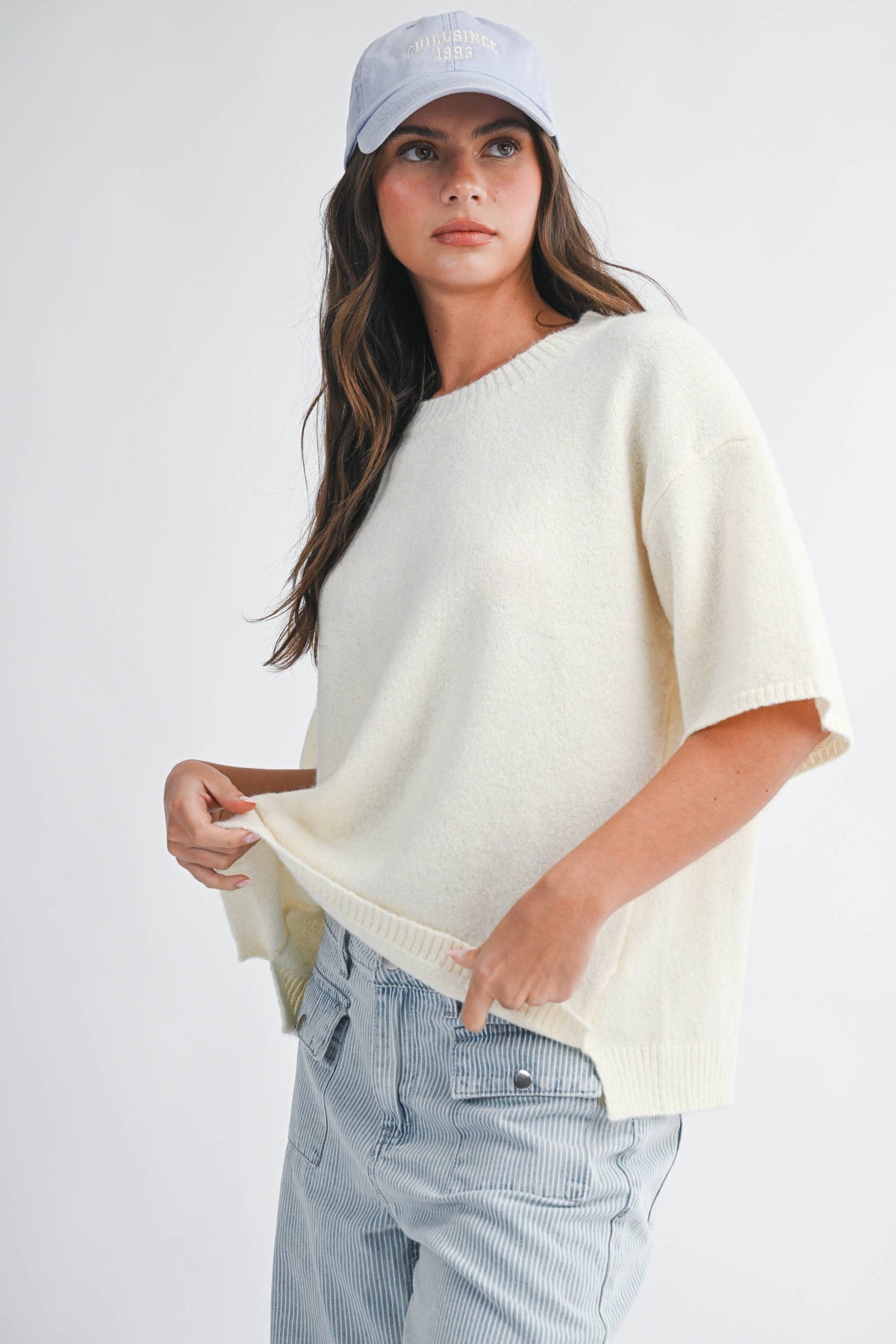 Soft knit top with ribbed details and relaxed fit.