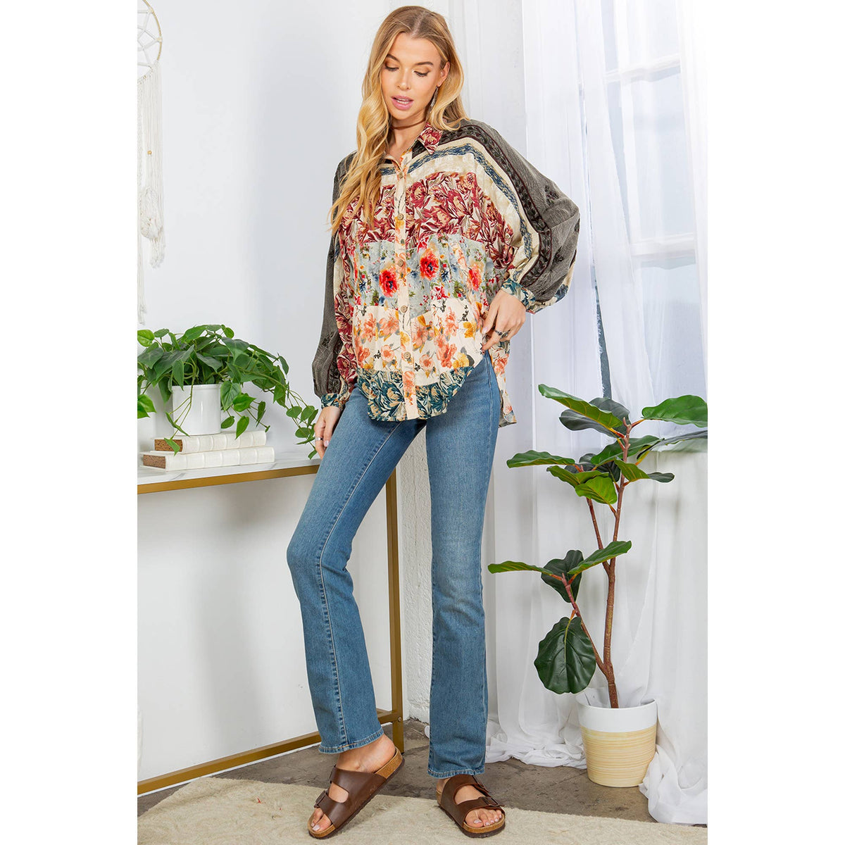 Elegant floral embroidered blouse for women with balloon sleeves and button details.