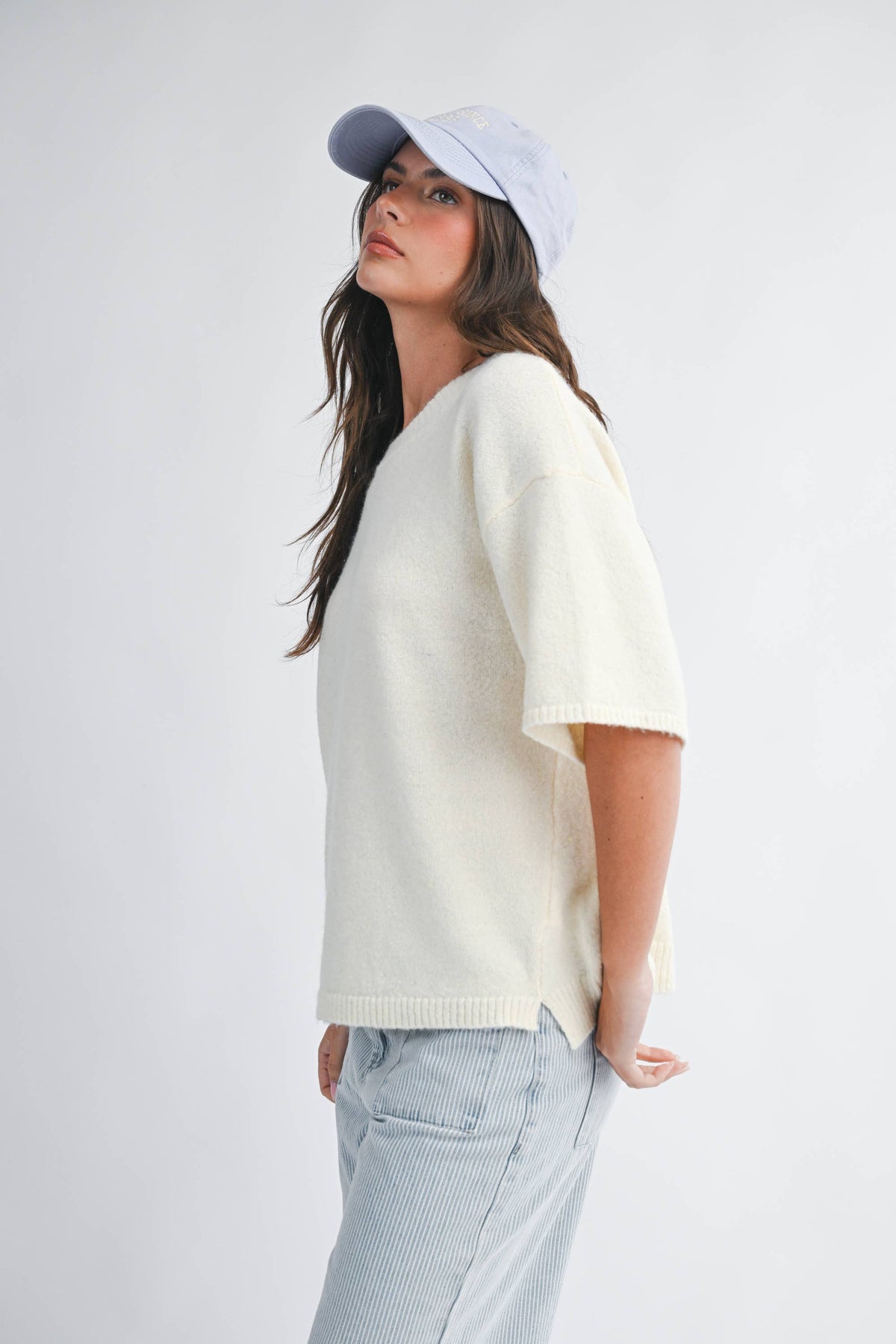 Soft knit top with ribbed details and relaxed fit.