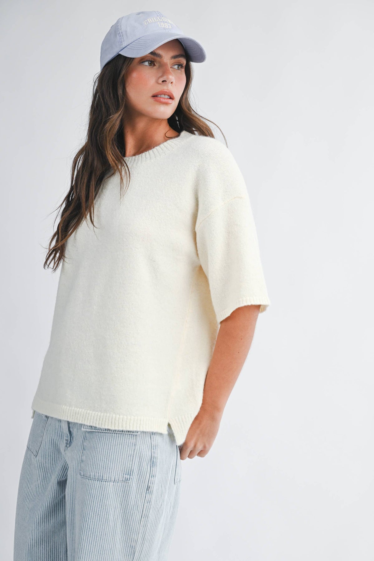 Soft knit top with ribbed details and relaxed fit.