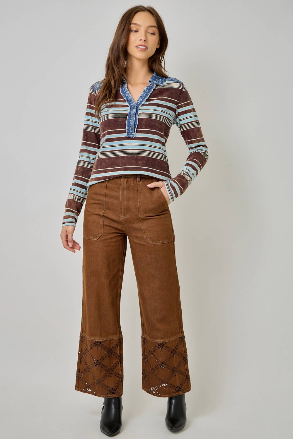 Women’s striped denim blouse with long sleeves and shirt collar.