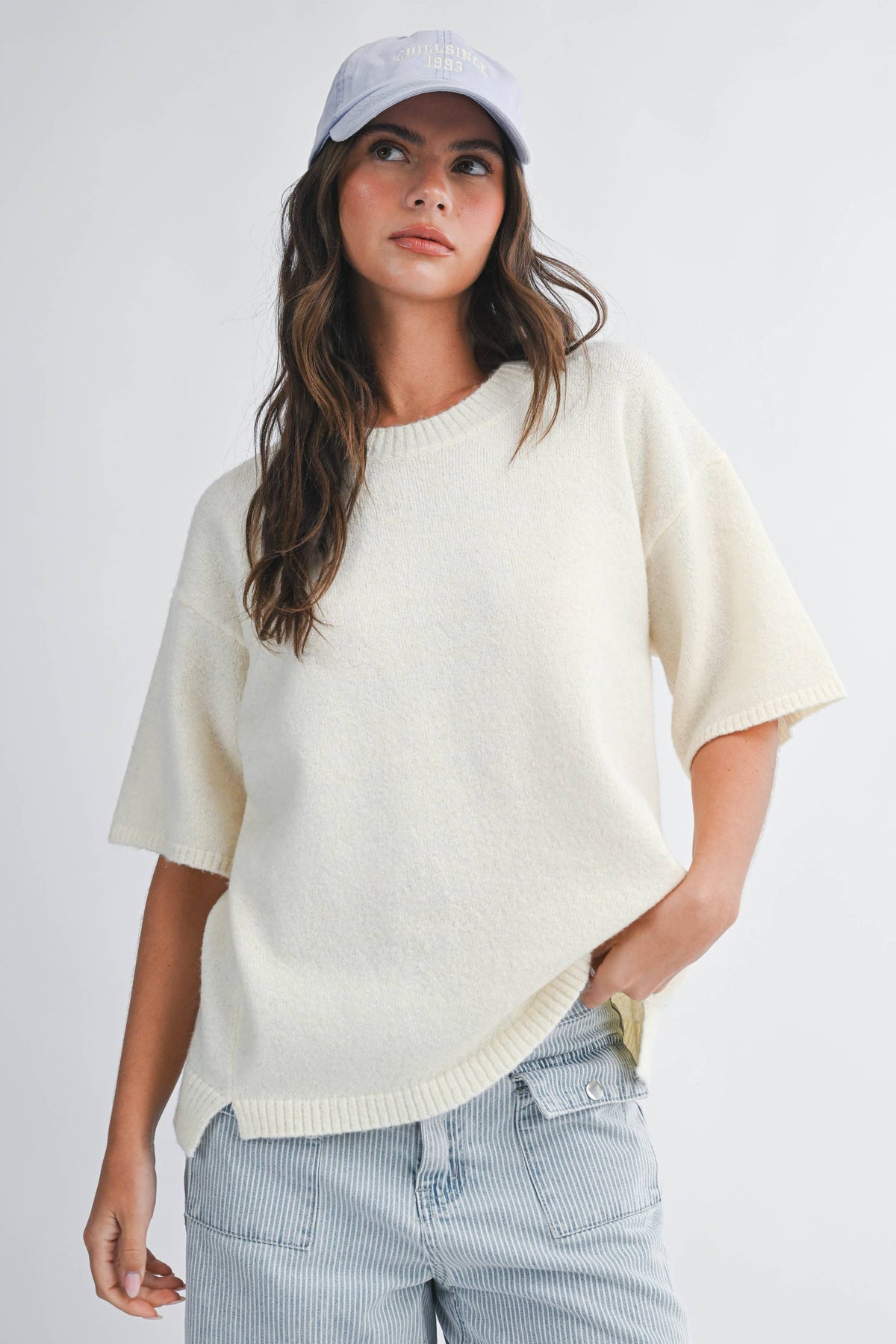 Soft knit top with ribbed details and relaxed fit.