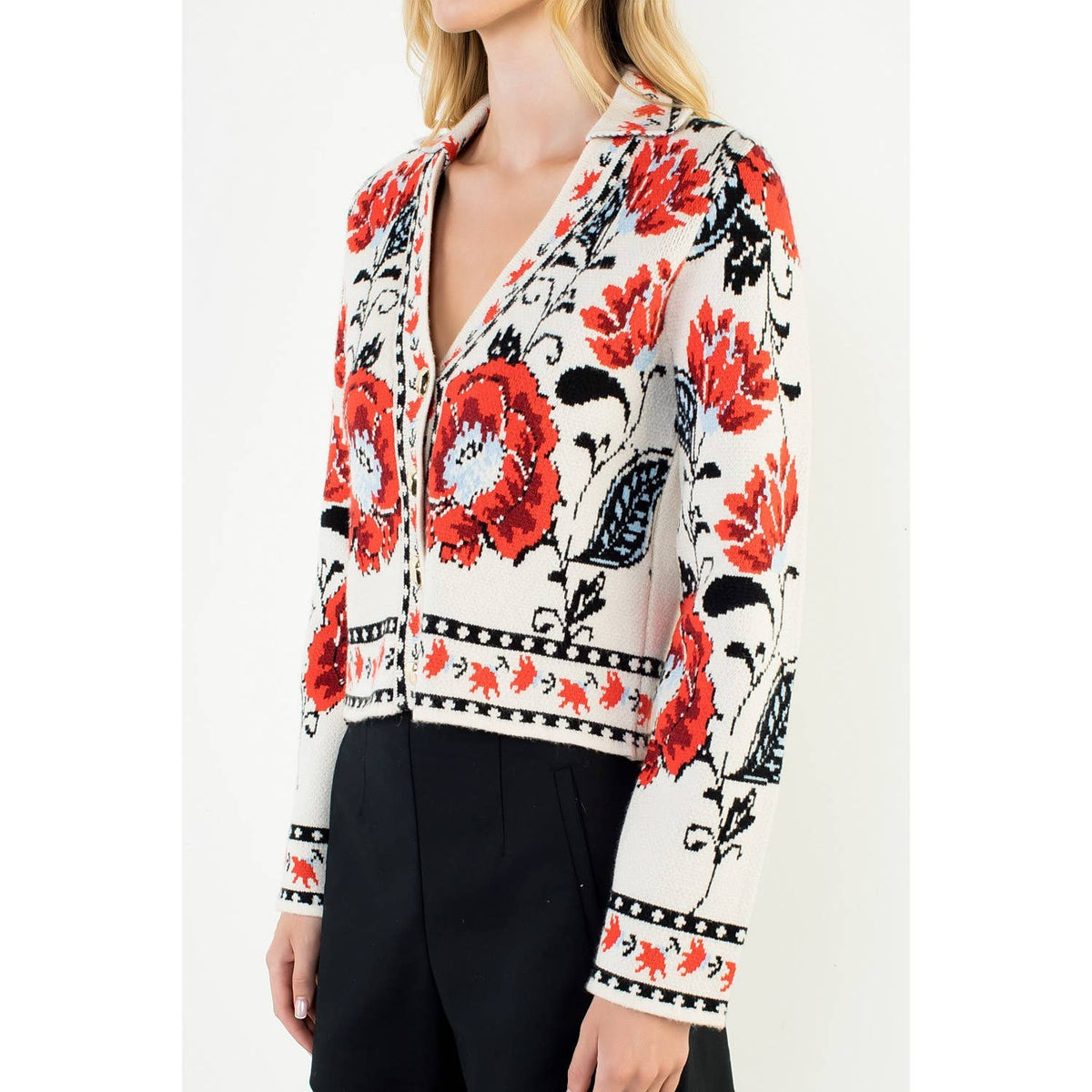 A stylish women's cropped jacket with knitted details and ribbed cuffs.