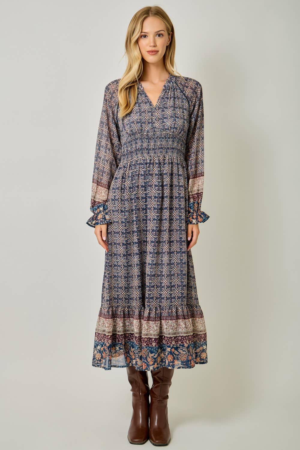 A feminine midi dress with ruffled details and a smocked waist.