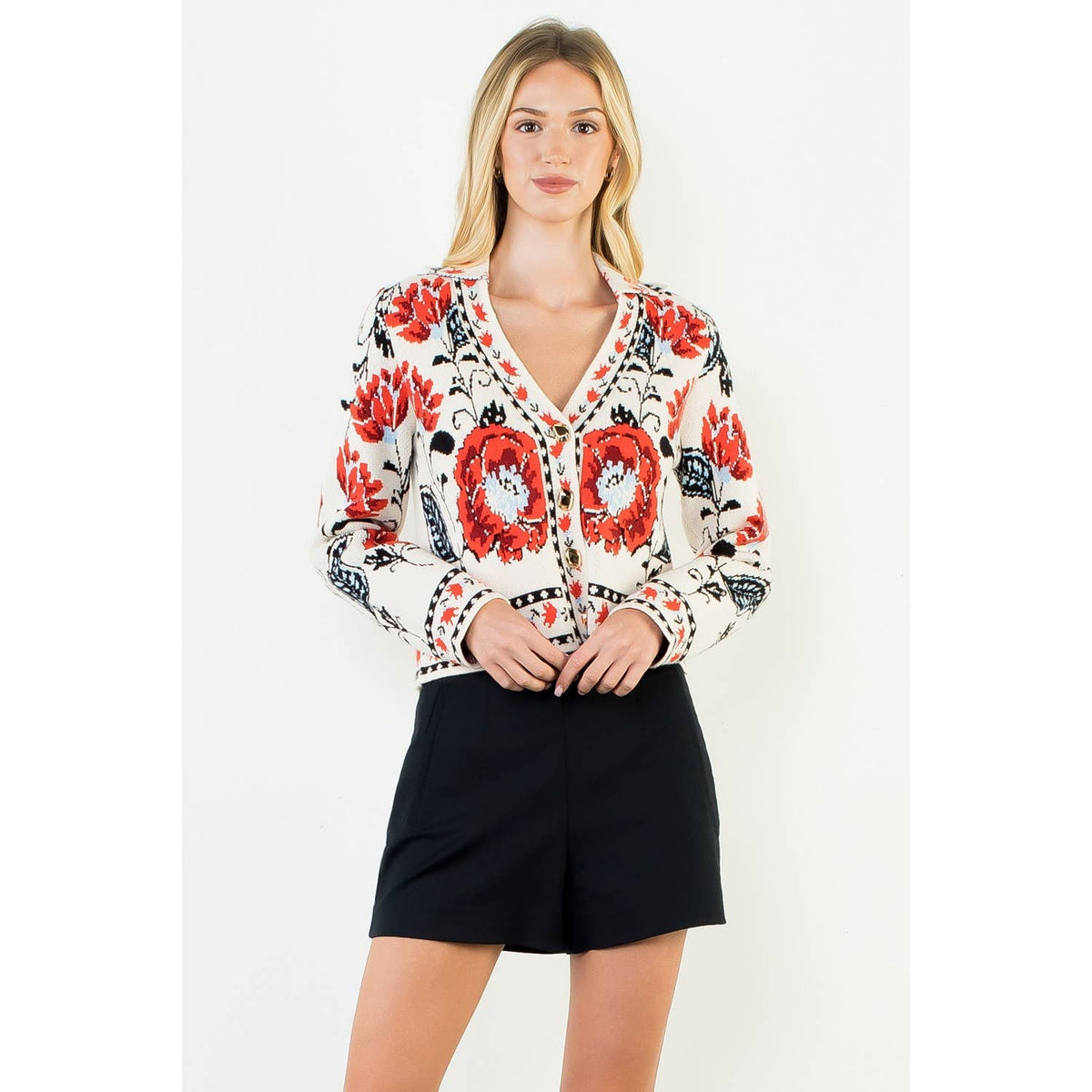 A stylish women's cropped jacket with knitted details and ribbed cuffs.