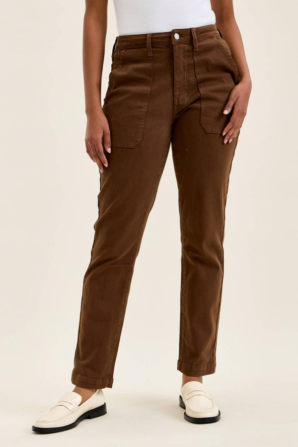 High-rise fitted jeans with rolled cuffs and multiple pockets.