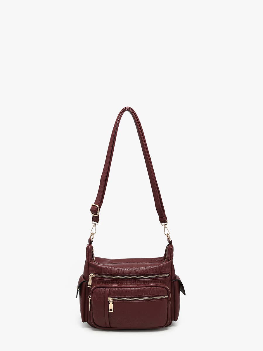 A stylish long shoulder bag with adjustable straps and multiple compartments for urban use.