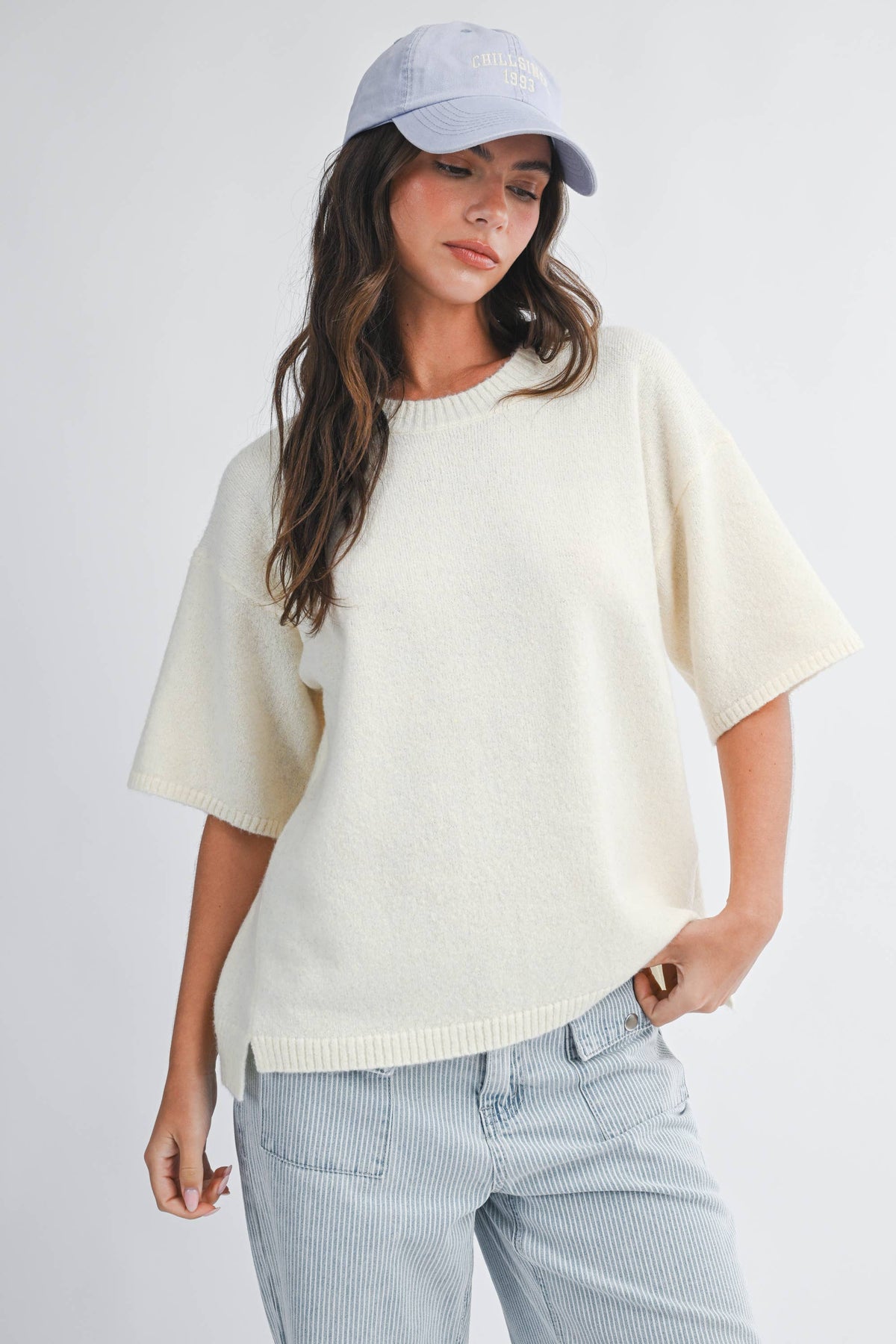 Soft knit top with ribbed details and relaxed fit.