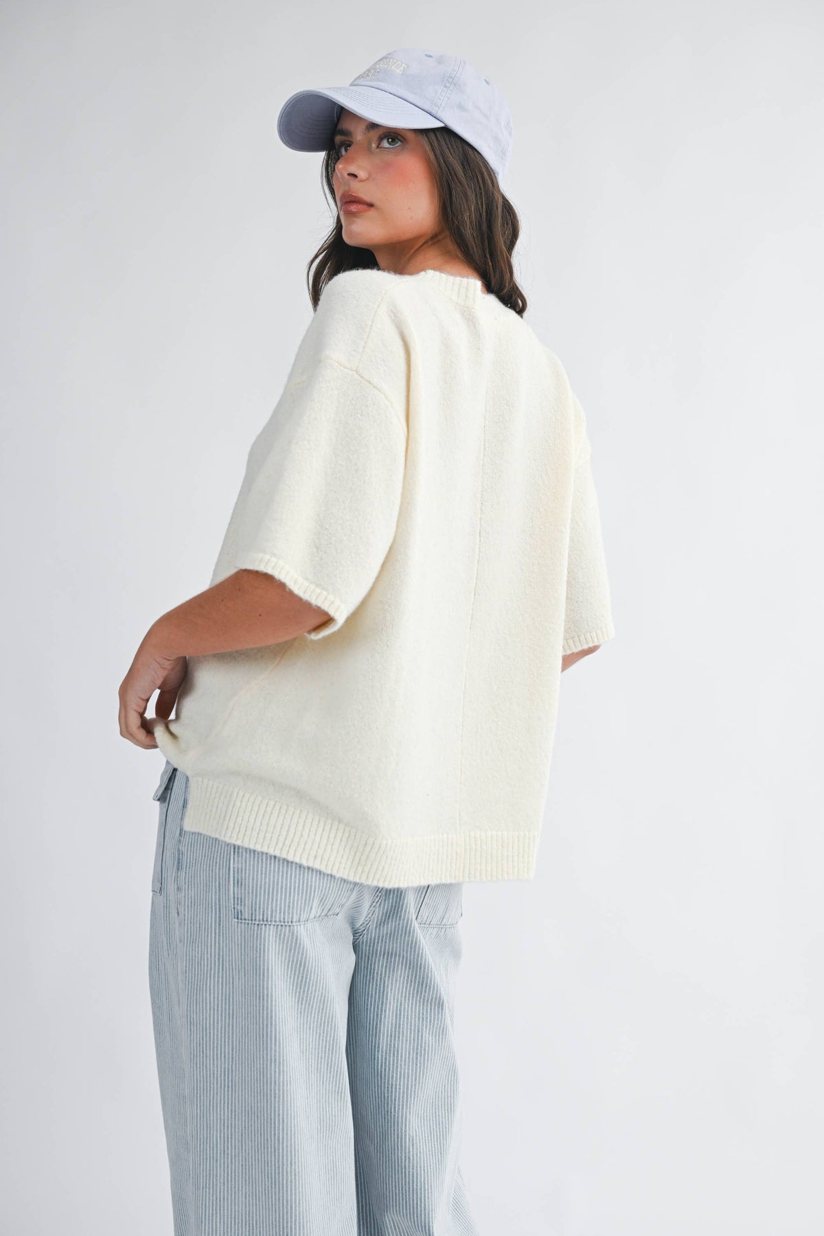 Soft knit top with ribbed details and relaxed fit.