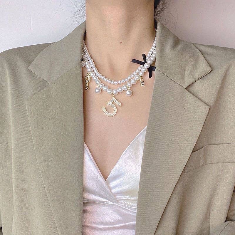 Pearlies Necklace with Symbolic Charms in Ivory