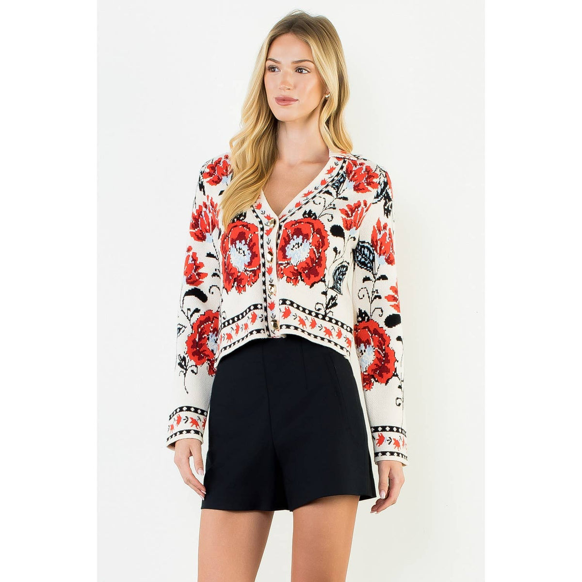 A stylish women's cropped jacket with knitted details and ribbed cuffs.