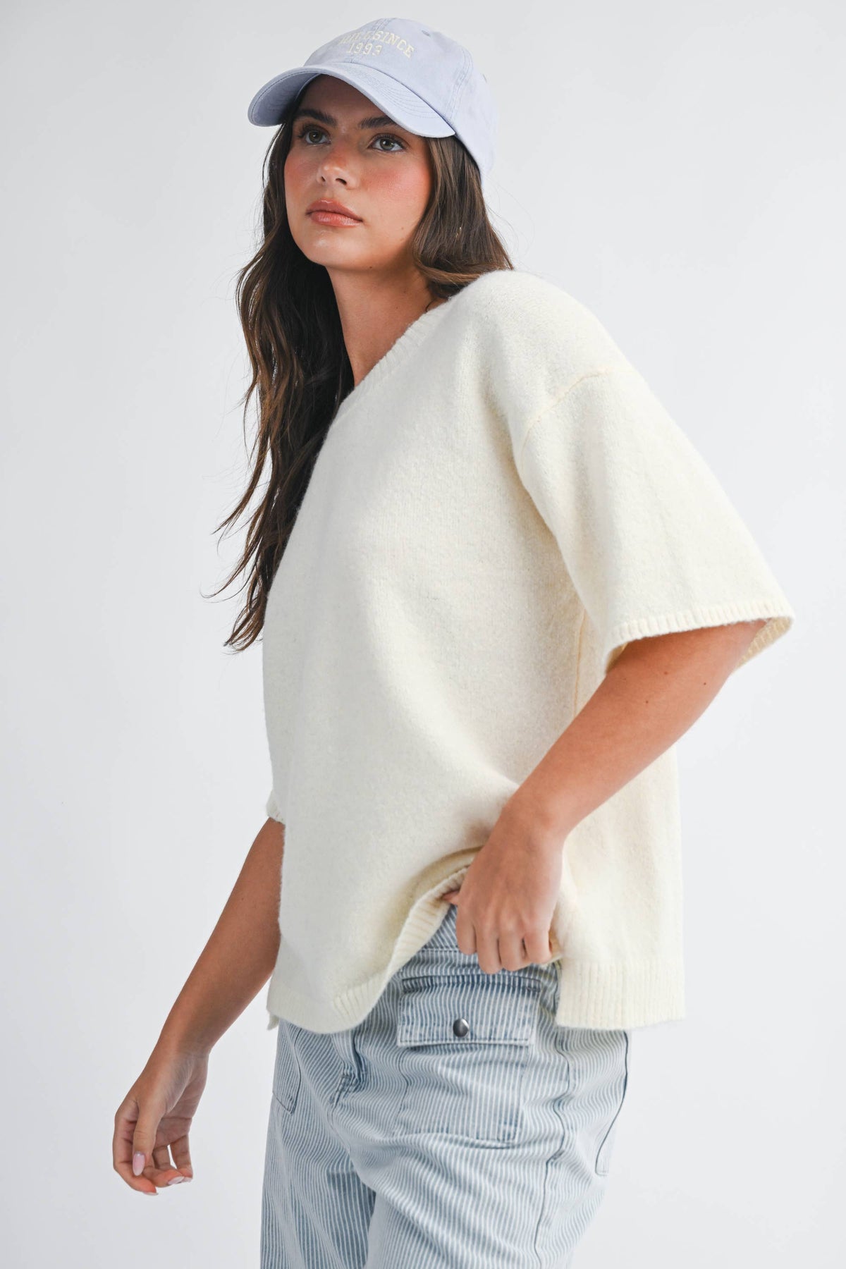 Soft knit top with ribbed details and relaxed fit.